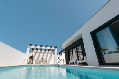 Private swimming pool with pergola